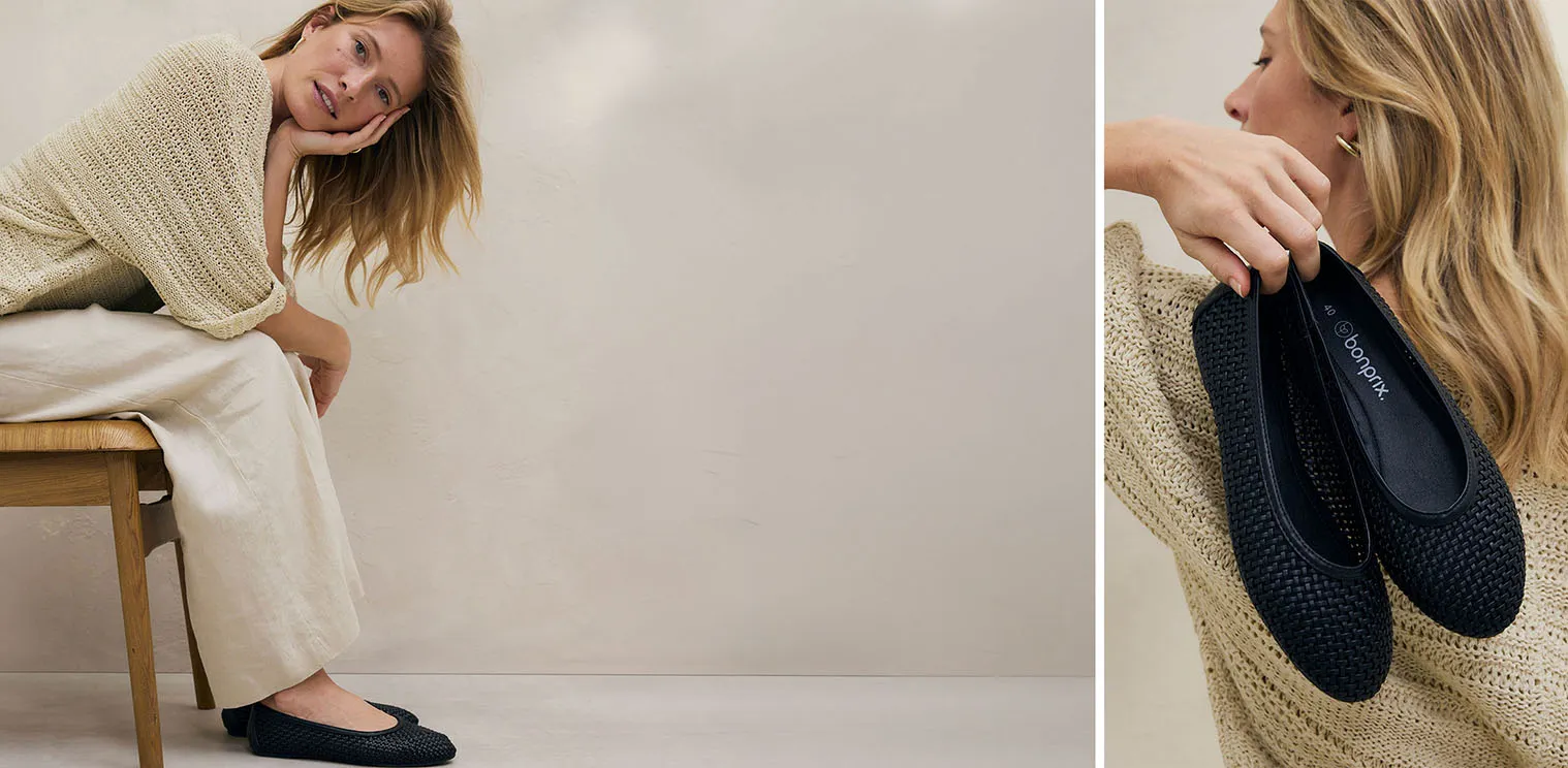 Ciepły sweter z dzianiny w kolorze kremowym i szerokie lniane spodnie tworzą wygodną, elegancką stylizację.